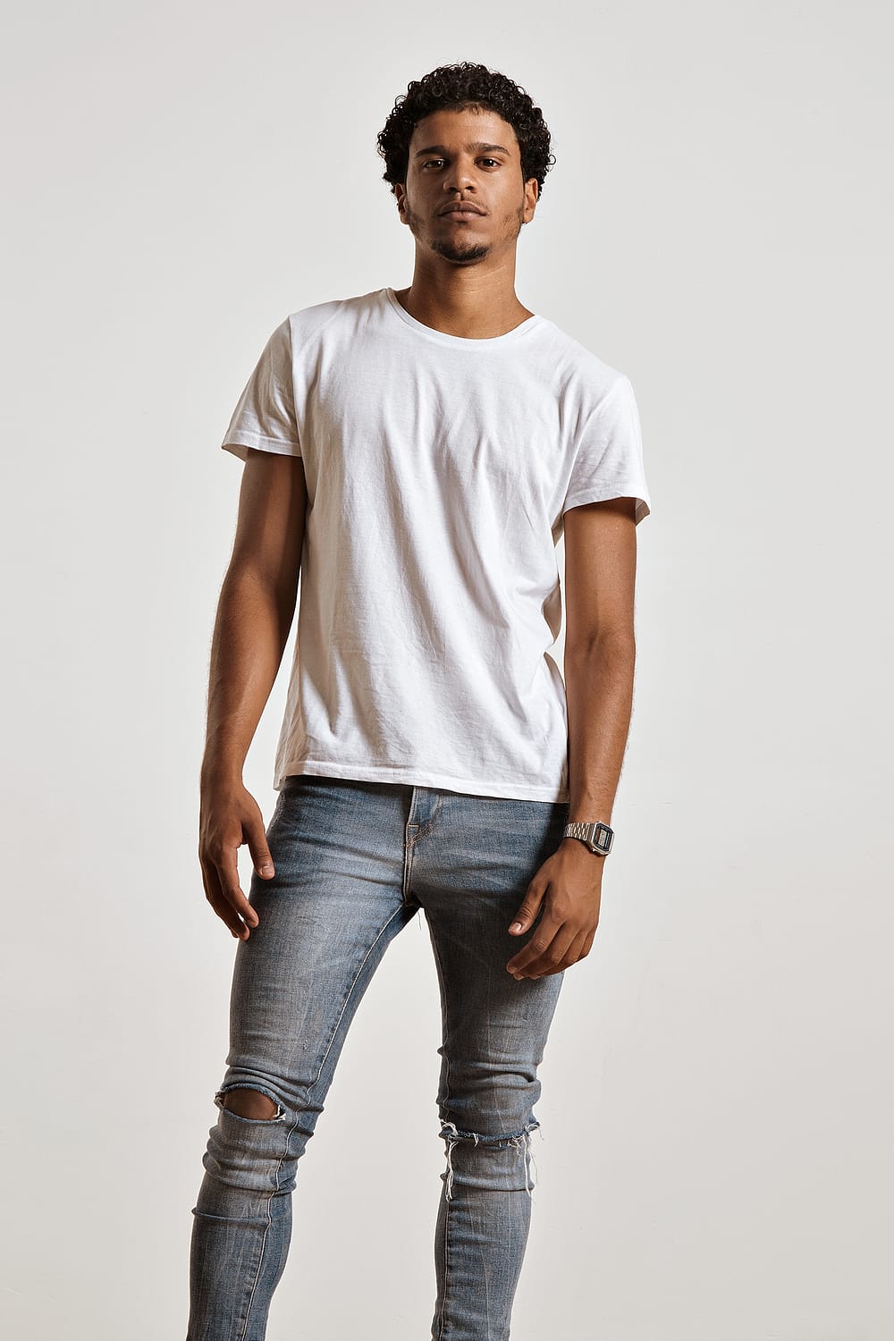 Fashion photo of a handsome man in black t-shirt