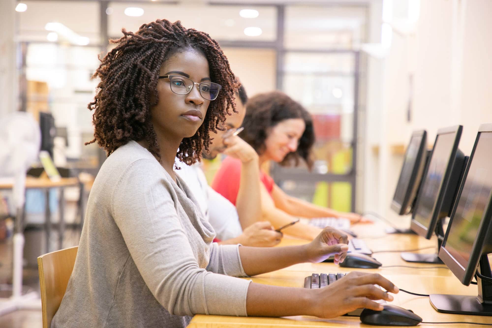 black-woman-adult-student-working-computer-class (1)