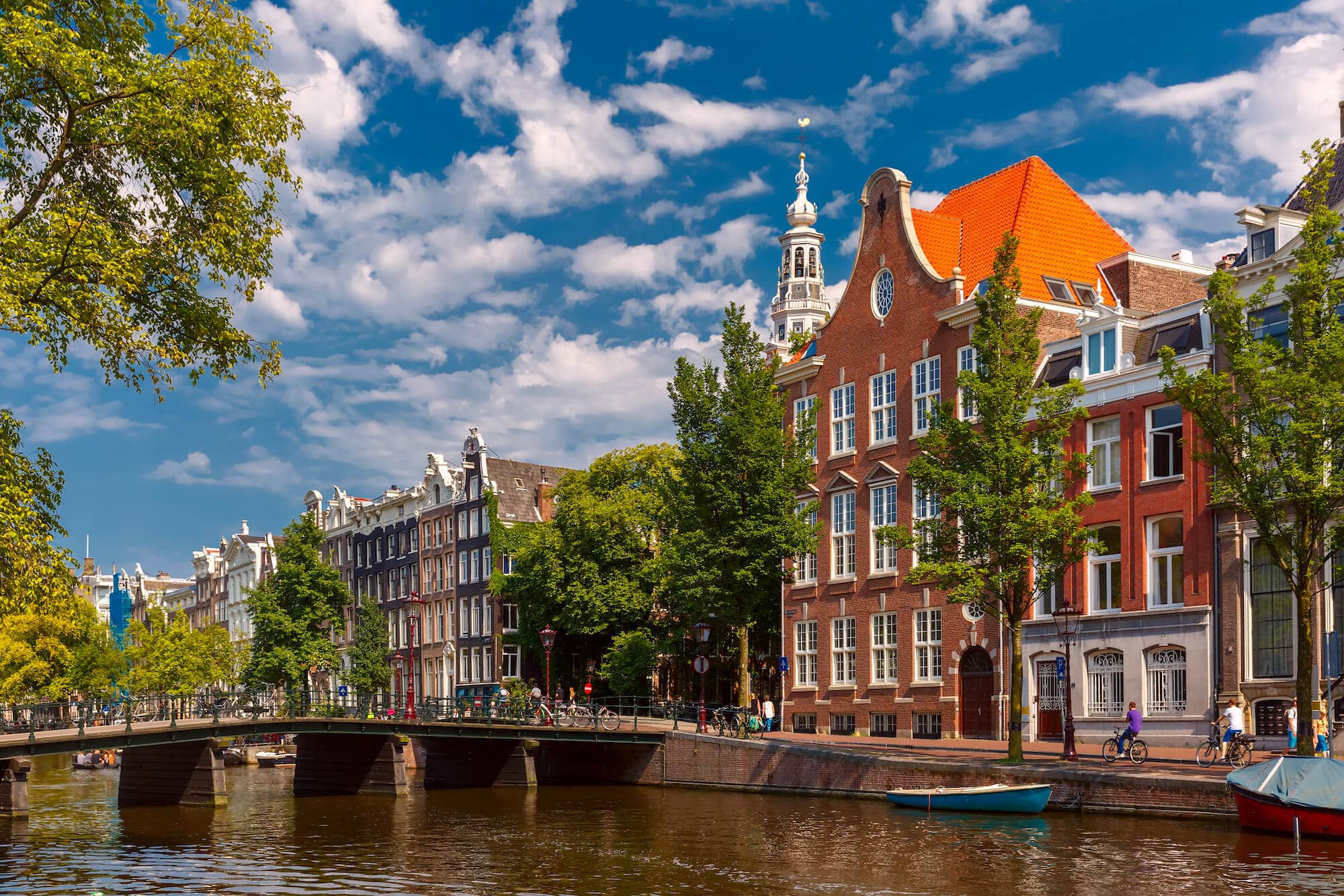 amsterdam-canal-bridge-church-typical-houses-sunny-summer-day-holland-netherlands (1)